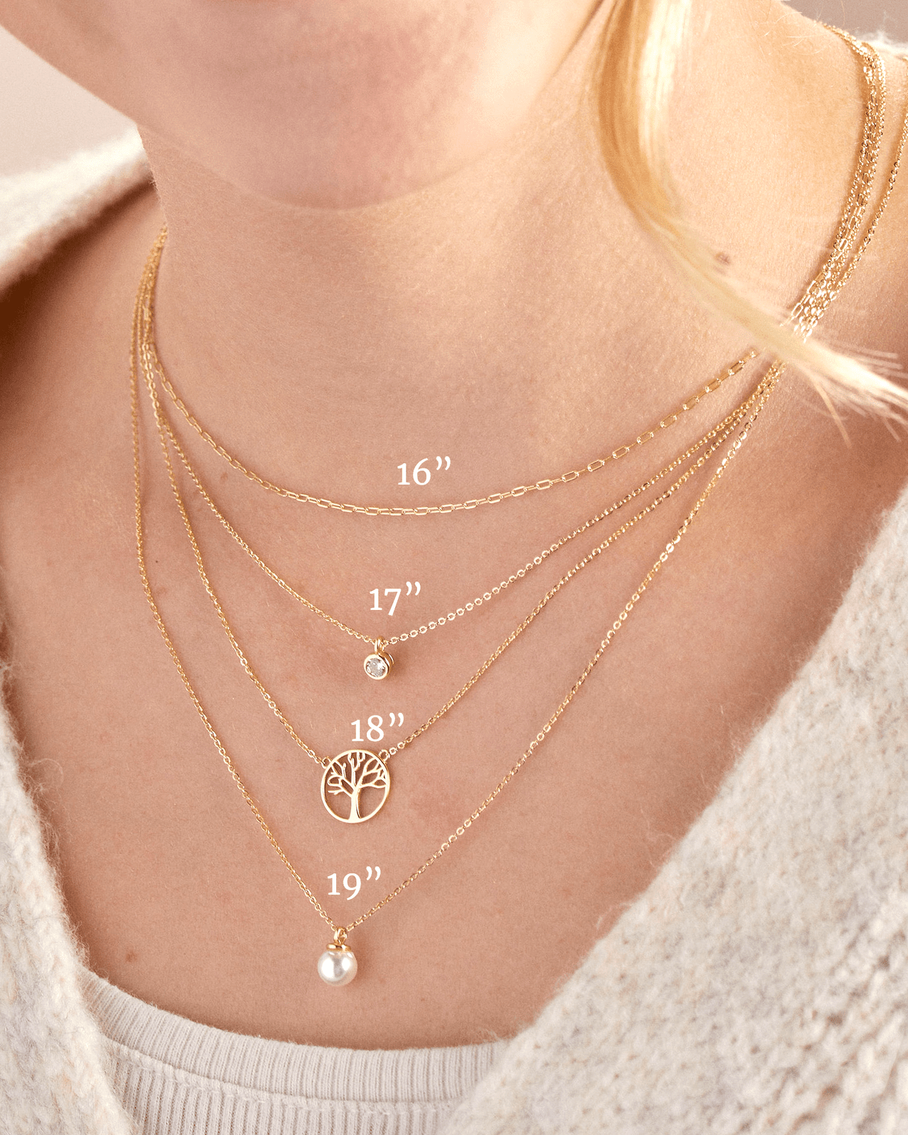 Jewelry sizing reference image that shows four sterling silver necklaces layered at 16 inches, 17 inches, 18 inches, and 19 inches